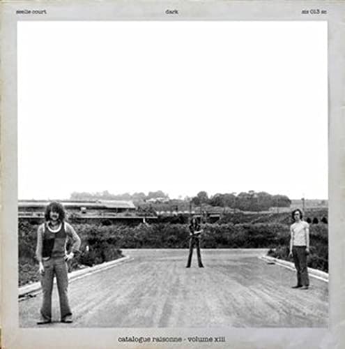 Black and white album cover featuring two people standing on a road.
