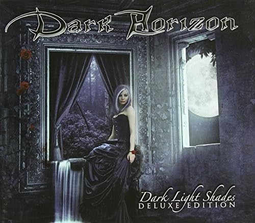 CD cover: woman in black dress framed by a gothic window.