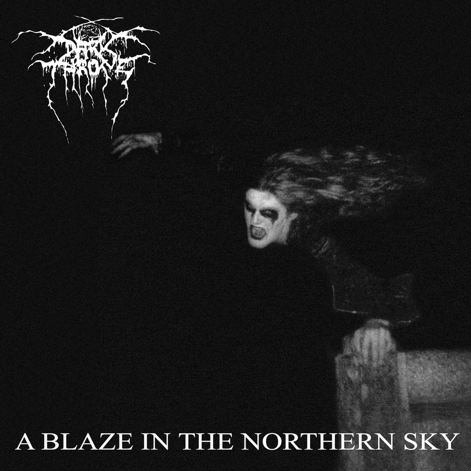 Black and white album cover featuring a high-contrast, grainy close-up of a band member.