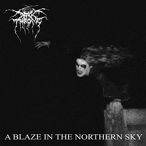 Black and white album cover featuring a person with corpse paint and long hair.