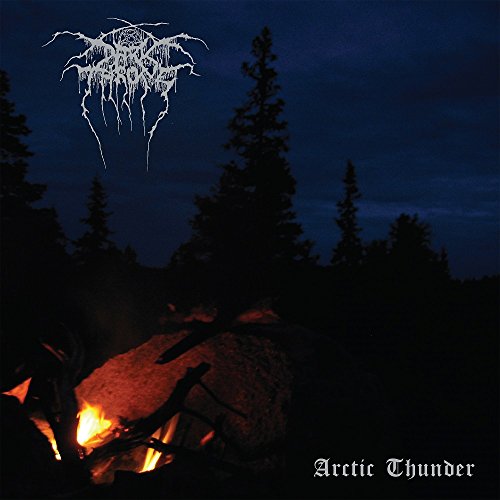 Darkthrone album cover: campfire in a dark forest under a night sky.