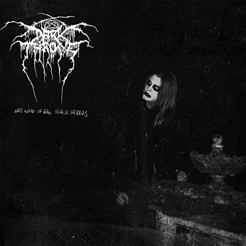 Darkthrone album cover: a dark, grainy image of a person and statue.