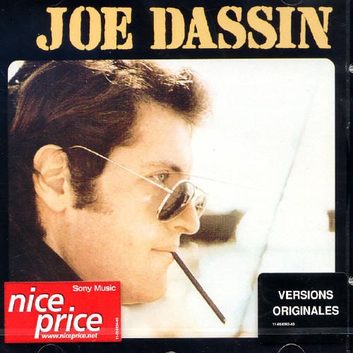 Joe Dassin album cover featuring a portrait of the singer with sunglasses.