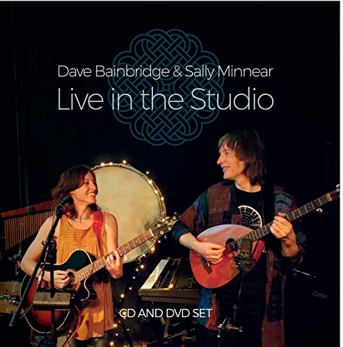 "CD and DVD cover featuring a man and woman playing guitars on stage."