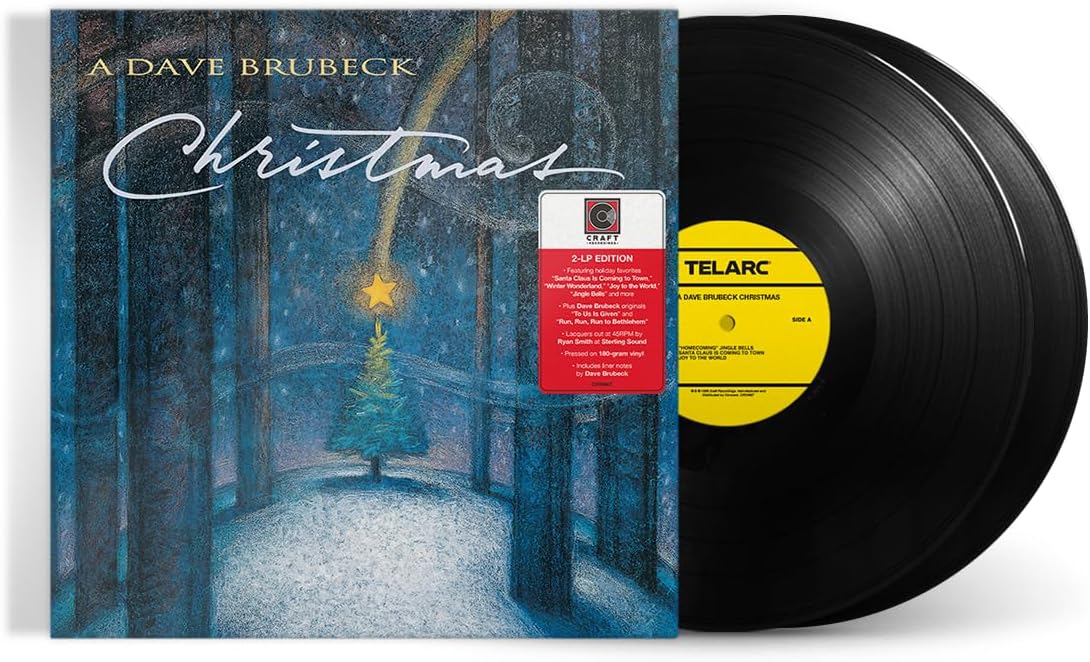 "Vinyl record with blue Christmas album cover, featuring a tree and arches."