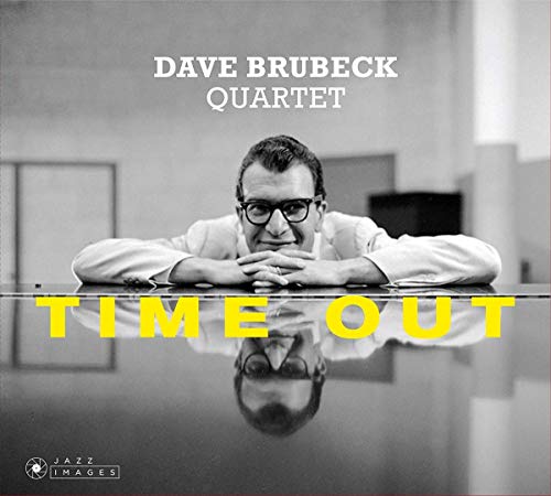 Black and white album cover of Dave Brubeck leaning on a piano.