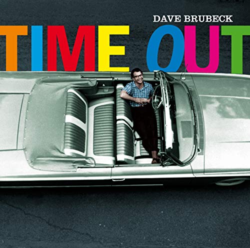 Dave Brubeck album cover: man by a vintage convertible, colorful text.