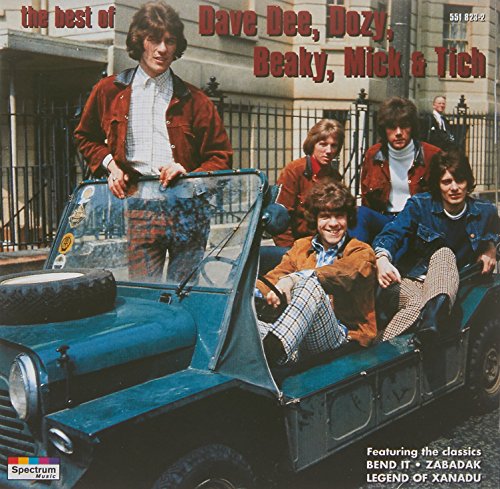 1960s band Dave Dee, Dozy, Beaky, Mick & Tich posing with a blue car.