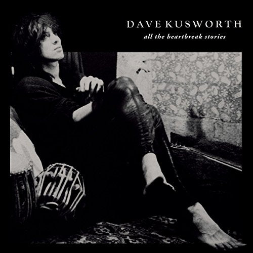Black and white album cover featuring a seated musician, Dave Kusworth.