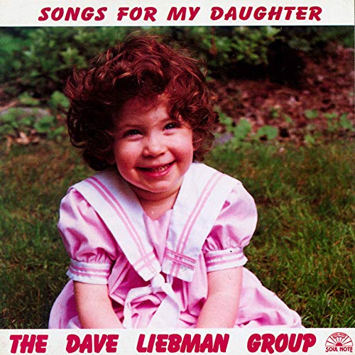 CD cover featuring a smiling young girl with curly hair.