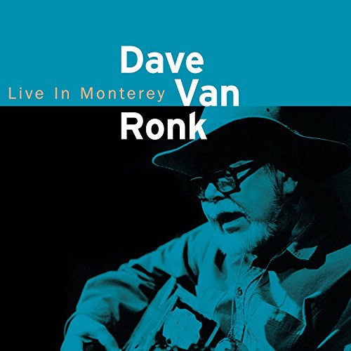 "CD cover with blue-tinted image of man playing guitar, wearing hat and glasses."