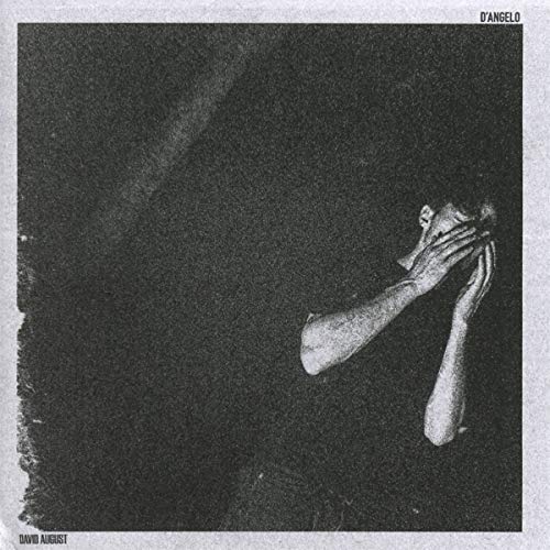 Black and white album cover featuring a person covering their face.