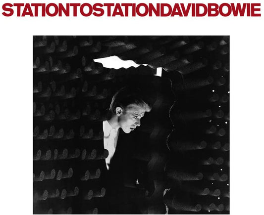 Black and white album cover featuring David Bowie in a train car.