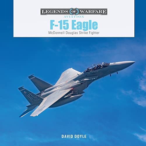 F-15 Eagle fighter jet in flight against a blue sky.
