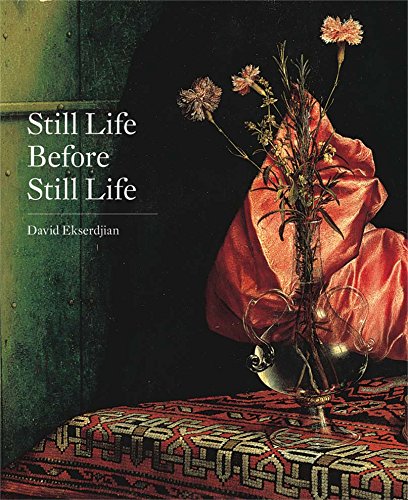 Book cover with flowers in a glass vase and draped red fabric.