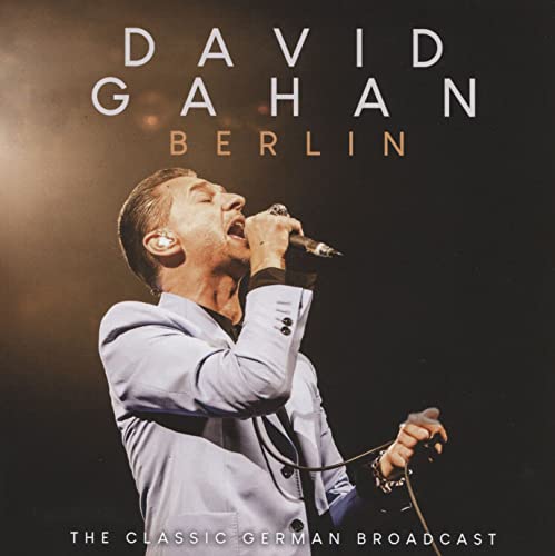 David Gahan singing into a microphone on the album cover "Berlin.