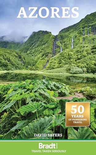 Book cover showing a lush green landscape with waterfalls, a lake, and tropical plants.