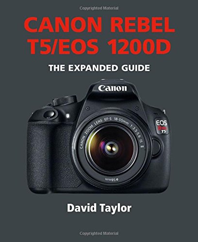 Black Canon Rebel T5/EOS 1200D camera with lens, and guide book cover.