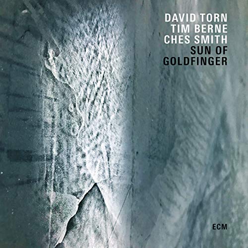 "Album cover with textured, blue-grey background and artist names in white and black text."