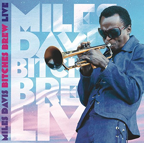 Miles Davis playing trumpet, album cover for "Bitches Brew Live.