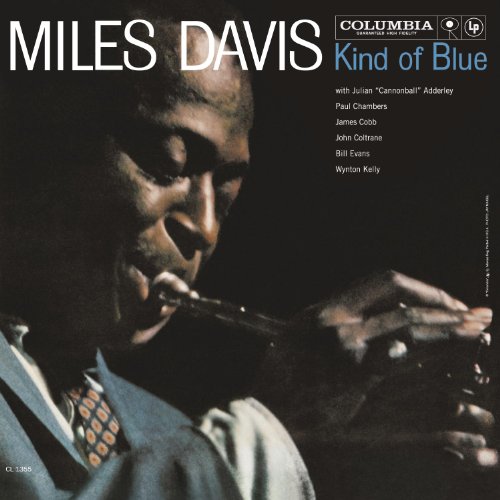 Miles Davis “Kind of Blue” vinyl album cover, portrait of Davis playing trumpet.