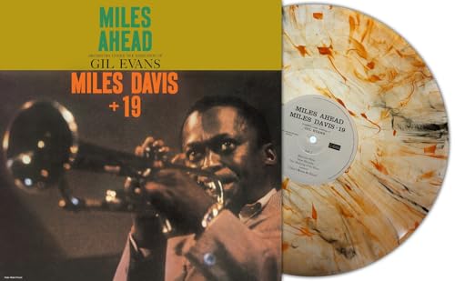Miles Davis album cover and orange marbled vinyl record.