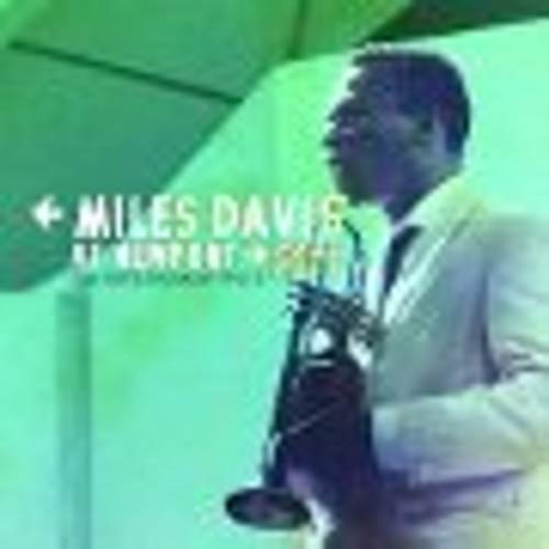 Miles Davis playing the trumpet on a green-tinted album cover.