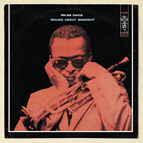 Album cover for Miles Davis’ “Round About Midnight” featuring a portrait of Davis.