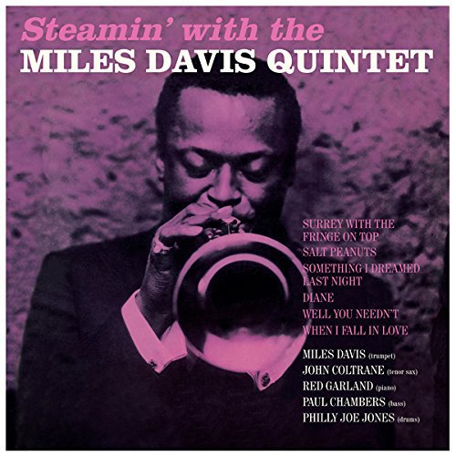 Album cover featuring Miles Davis playing trumpet against a purple background with tracklist text.