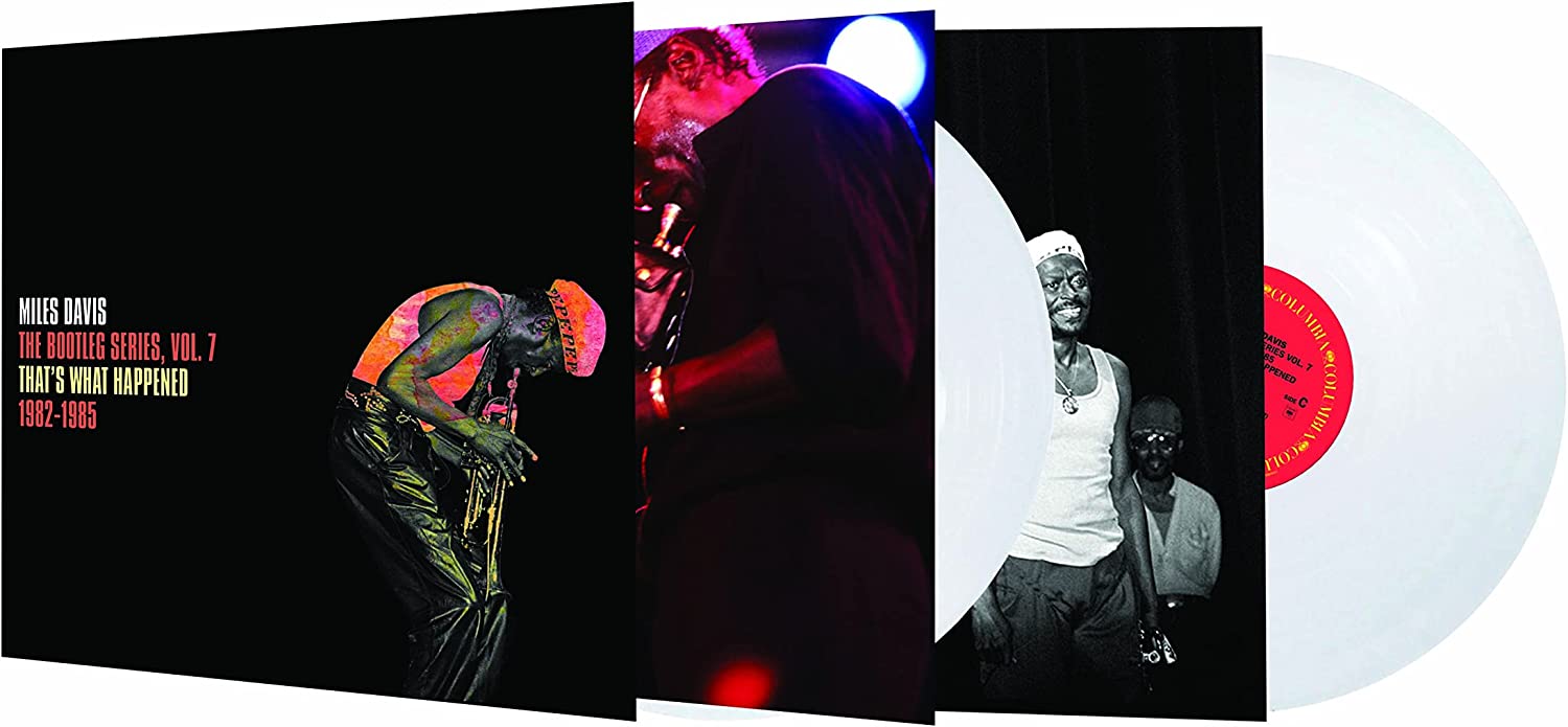 Miles Davis playing trumpet on a black background with album text on the left.