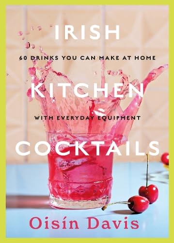 Book cover featuring a pink cocktail splashing from a glass with cherries on table.