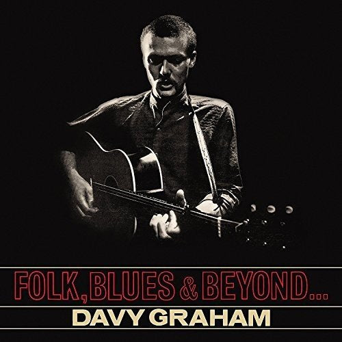 Black and white portrait of Davy Graham playing an acoustic guitar.