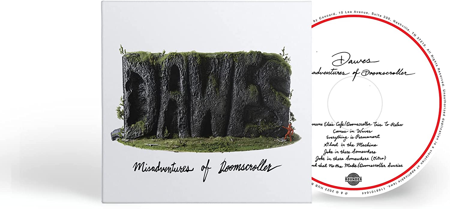 "Album cover featuring a cliff with arches and a small figure, titled 'Misadventures of Doomscroller'."