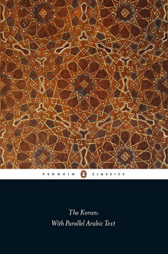 Book cover of "The Koran" with Islamic geometric patterns.