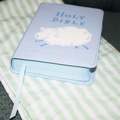 Blue children’s Bible with a sheep illustration and ribbon bookmark.