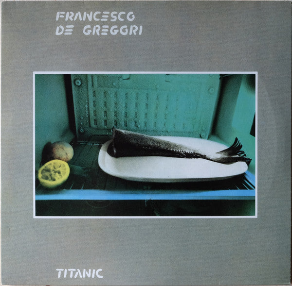 Vinyl record cover: fish on a plate before a green radiator.