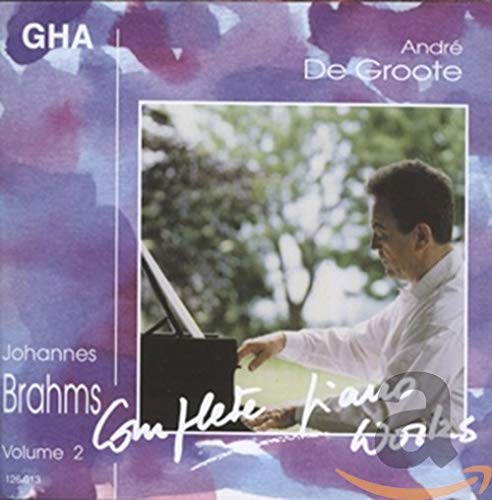 CD cover featuring a man playing a piano against a purple watercolor background.