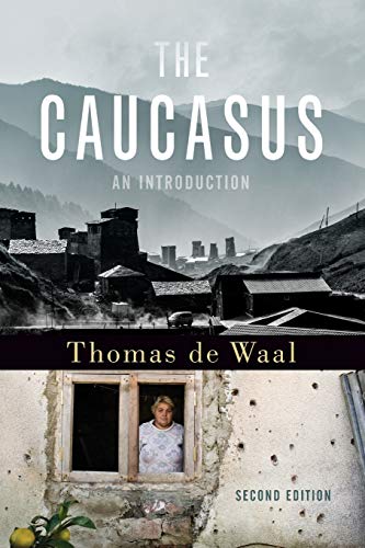 Book cover: "The Caucasus," featuring a village and portrait in a window.