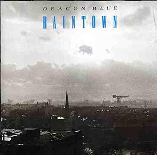 Deacon Blue’s “Raintown” CD cover: a grey, industrial cityscape under clouds.