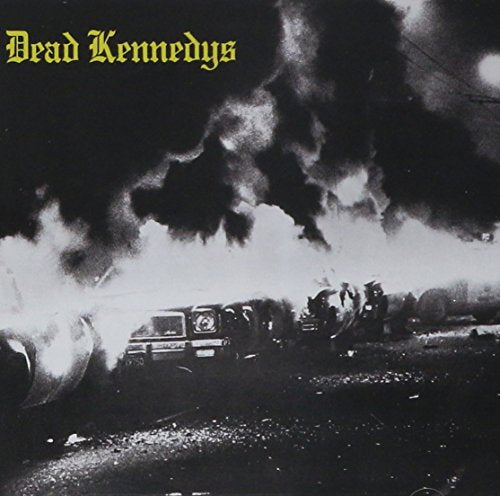 "Dead Kennedys album cover: black and white photo of burning oil tanks with firefighters."