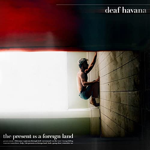 Vinyl album cover: man in doorway, abstract red and grey background.