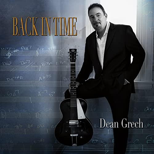 CD cover featuring Dean Grech with a guitar and musical notes.
