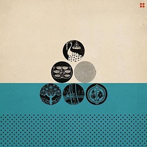 Vinyl record cover with six dark circular designs on a split background.