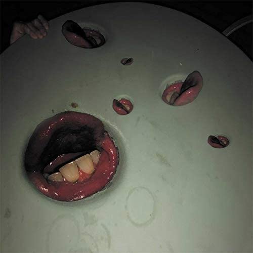 Album cover featuring multiple disembodied, fleshy lips with teeth.