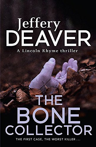 Book cover: dark image of a hand stitched to bone fragments.