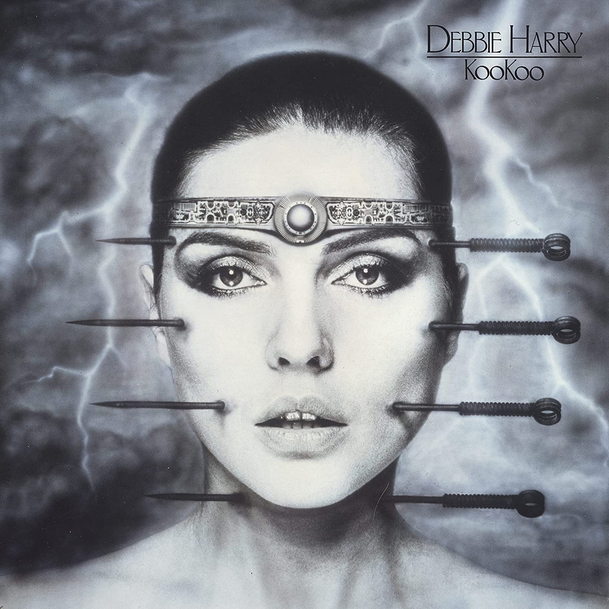 Black and white album cover featuring Debbie Harry with pins around her face.