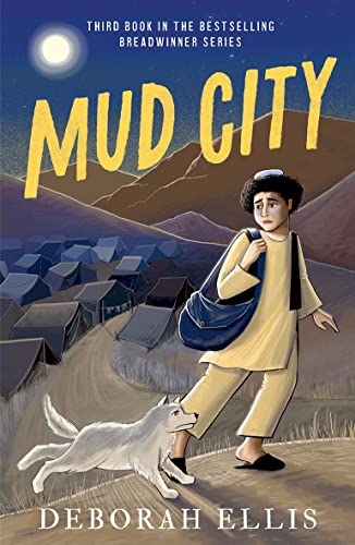 A boy with a shoulder bag and a dog walk past a refugee tent camp.