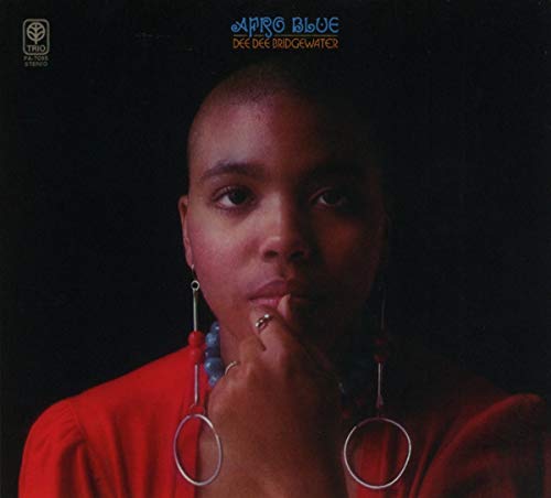 "CD album cover featuring Dee Dee Bridgewater in red, with beaded necklace and large earrings."