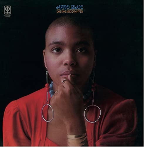 Dee Dee Bridgewater’s “Afro Blue” LP cover: portrait of a woman in red.