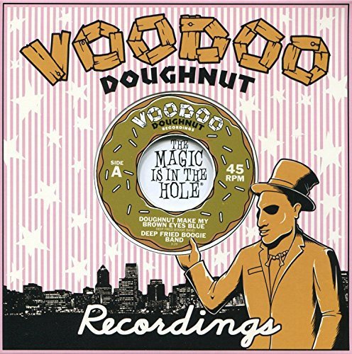 A man in a top hat holds a doughnut-shaped vinyl record against a cityscape.